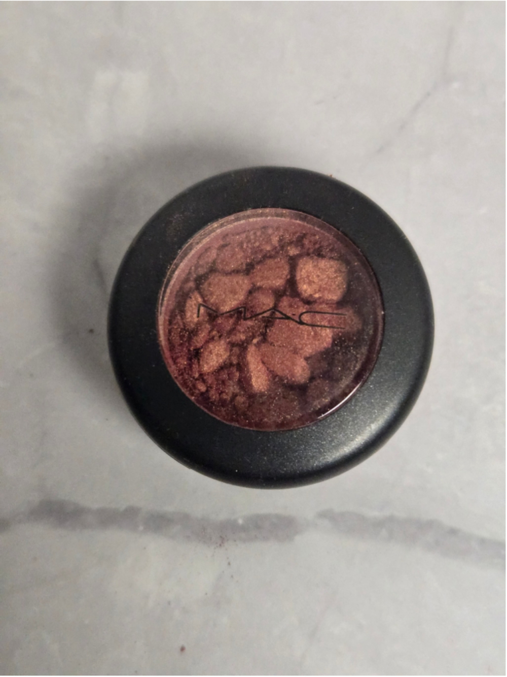 MAC Cosmetics brand Eyeshadow in the Shade Expensive Pink.